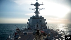 FILE - The U.S. Navy's Arleigh Burke-class guided-missile destroyer USS Sampson conducts a routine Taiwan Strait transit, April 26, 2022. (U.S. Pacific Command via AP)