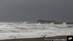 Waves from the Bering Sea splash up on a jetty in Nome, Alaska, Sept. 16, 2022.