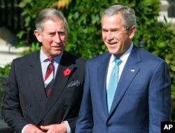FILE - President George W. Bush, right, greets Britain's Prince Charles on the South Portico of the White House in Washington, Nov. 2, 2005.