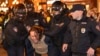 FILE - Police officers detain a man during a protest in Moscow, Sept. 21, 2022.