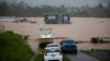 Una casa está sumergida en las inundaciones causadas por el huracán Fiona en Cayey, Puerto Rico, el domingo 18 de septiembre de 2022.