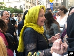 Shamim Syed, Adnan Syed's mother, celebrates with others outside the Cummings Courthouse, in Baltimore, Sept. 19, 2022.