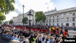 Procession where the coffin of Britain's Queen Elizabeth is transported from Buckingham Palace to the Houses of Parliament for her lying in state, in London, Sept. 14, 2022.