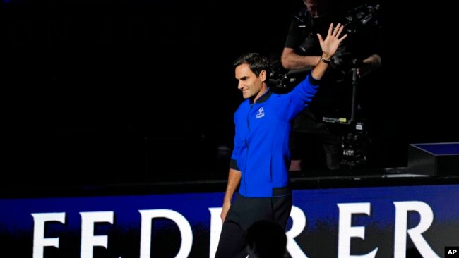 Team Europe's Roger Federer of Switzerland, waves during the opening ceremony of the Laver Cup tennis tournament at the O2 in London, Sept. 23, 2022.