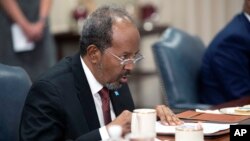 Somali President Hassan Sheik Mohamud speaks during a meeting with U.S. Defense Secretary Lloyd Austin during a meeting at the Pentagon, near Washington, Sept. 15, 2022.