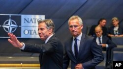 NATO Secretary-General Jens Stoltenberg, center, and US Secretary of State Antony Blinken, left, arrive for a meeting of NATO ambassadors at NATO headquarters in Brussels, Sept. 9, 2022.