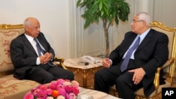 Interim President Adly Mansour, right, meets with Hazem el-Beblawi, left, in Cairo, Egypt, July 9, 2013. 