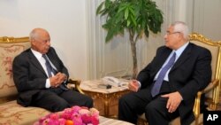 Interim President Adly Mansour, right, meets with Hazem el-Beblawi, left, in Cairo, Egypt, July 9, 2013. 