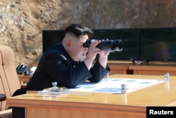 North Korean Leader Kim Jong Un looks on during the test-fire of inter-continental ballistic missile Hwasong-14 in this undated photo released by North Korea's Korean Central News Agency (KCNA) in Pyongyang, July, 4 2017.