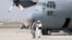 Taliban berjalan di depan pesawat militer sehari setelah penarikan pasukan AS dari Bandara Internasional Hamid Karzai di Kabul, Afghanistan 31 Agustus 2021. (Foto: Reuters)