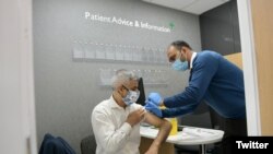 London Mayor Sadiq Khan gets a flu vaccine in this image posted to Twitter Sept. 28, 2020.