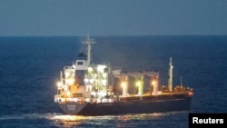 The Sierra Leone-flagged cargo ship Razoni, carrying Ukrainian grain, is seen in the Black Sea off Kilyos, near Istanbul, Turkey August 2, 2022.