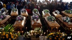 File: A view of the coffins during a funeral service held in Scenery Park, East London, South Africa, July 6, 2022.