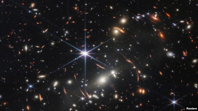 The first full-color image released by NASA from the James Webb Space Telescope shows the galaxy cluster SMACS 0723, in a composite made from images at different wavelengths taken with a Near-Infrared Camera and released July 11, 2022. (Image Credit: NAS