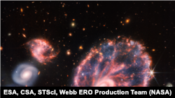 This image from Webb&rsquo;s Webb&rsquo;s Near-Infrared Camera (NIRCam) shows a group of galaxies, including a large distorted ring-shaped galaxy known as the Cartwheel.&nbsp;The Cartwheel Galaxy, located 500 million light-years away in the Sculptor constellation, is composed of a bright inner ring and an active outer ring. While the outer ring has a lot of star formation, the dusty area in between reveals many stars and star clusters.
