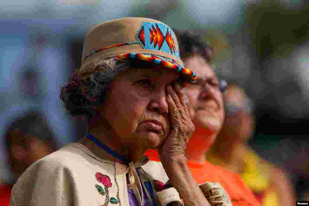 Nancy Saddleman, 82, who spent 14 years at Kamloops Indian residential school from 1945-59, since she was 5 years old, cries while attending a mass presided by Pope Francis at Commonwealth Stadium in Edmonton, Alberta, Canada, July 26, 2022. 