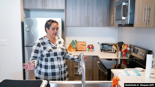 Lisa Raskin, a teacher at Jefferson Union High School District, talks in the kitchen of her new apartment, July 8, 2022.