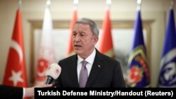 Turkish Defense Minister Hulusi Akar talks after Russian, Ukrainian and Turkish military delegations met with U.N. officials in Istanbul, July 13, 2022.