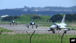 Taiwan Air Force Mirage fighter jets taxi on a runway at an airbase in Hsinchu, Taiwan, Aug. 5, 2022.