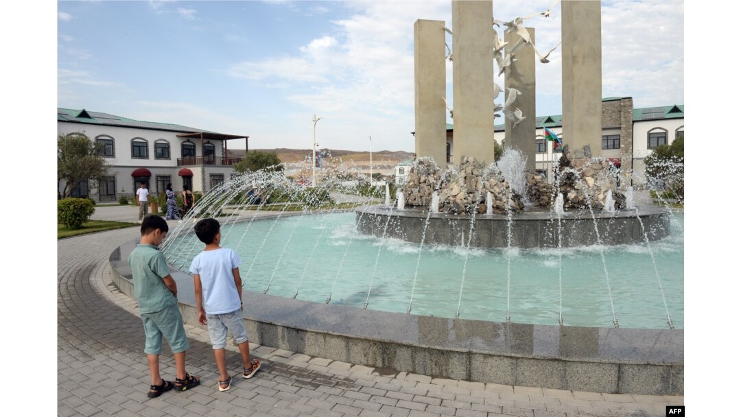 Children explore the newly rebuilt village of Agali in the district of Zangilan, Azerbaijan, July 19, 2022.
