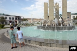 Children explore the newly rebuilt village of Agali in the district of Zangilan, Azerbaijan, July 19, 2022.