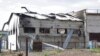 This frame from a video shows a destroyed barracks at a prison in Olenivka, in an area controlled by Russian-backed separatist forces, eastern Ukraine, July 29, 2022. Russia and Ukraine accused each other Friday of shelling the prison.