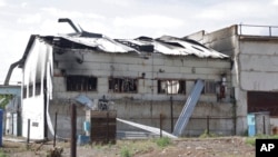 This frame from a video shows a destroyed barracks at a prison in Olenivka, in an area controlled by Russian-backed separatist forces, eastern Ukraine, July 29, 2022. Russia and Ukraine accused each other Friday of shelling the prison.