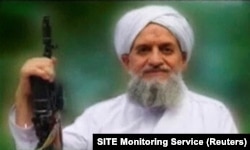 FILE - A photo of al-Qaida leader, Egyptian Ayman al-Zawahiri, is seen in this still image taken from a video released on Sept. 12, 2011. (SITE Monitoring Service/Handout via Reuters TV)