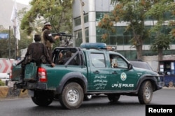 Taliban fighters drive a car on a street following the killing of al-Qaeda leader Ayman al-Zawahiri in a U.S. strike over the weekend, in Kabul, Afghanistan, August 2, 2022.