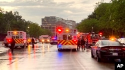 In this photo provided by @dcfireems, emergency medical crews are staged between the White House and Lafayette Park, Aug. 4, 2022 in Washington.