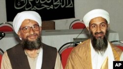 FILE - Osama bin Laden and chief aide Ayman al Zawahri (r-l), Khost, Afghanistan, in 1998.