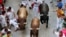 Revelers sprint during the running of the bulls at the San Fermin festival in Pamplona, Spain, July 14, 2022.