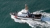 FILE - A U.S. Coast Guard vessel searches for survivors of a Puerto Rico National Guard helicopter crash, Dec. 22, 2010. The Coast Guard responded July 28, 2022, to a report of deaths related to a suspected human smuggling operation near Puerto Rico.