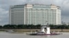 A ferry service transports passengers and vehicles along the Mekong River in front of the Sokha hotel that will host the 55th ASEAN Foreign Ministers' Meeting in Phnom Penh, Cambodia, Aug. 1, 2022.