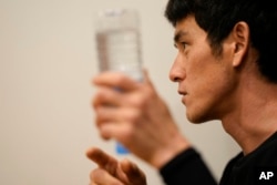 FILE - Lee Gwang-jin, who studied Koryo medicine before he fled North Korea in 2018, answers a reporter's question during an interview in Paju, South Korea, July 14, 2022.