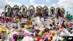 A memorial for the supermarket shooting victims is set up outside the Tops Friendly Market, July 14, 2022, in Buffalo, New York.