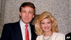 FILE - Donald and Ivana Trump pose outside the Federal Courthouse in New York after she was sworn in as a United States citizen, May 25, 1988.