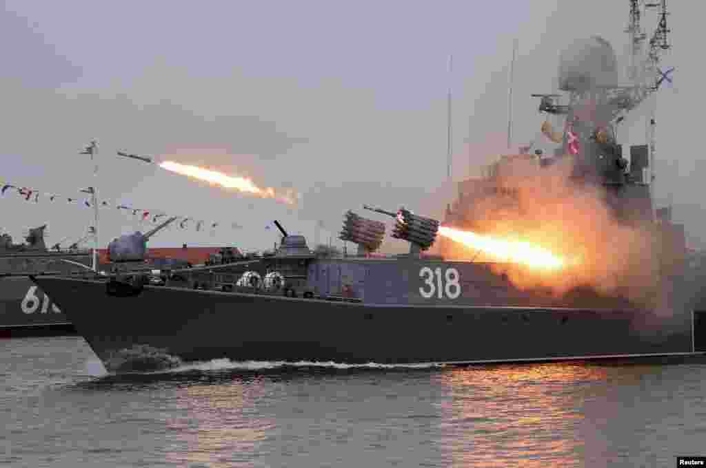 The Russian corvette Aleksin fires missiles during a parade marking Navy Day in Baltiysk in the Kaliningrad region, Russia.