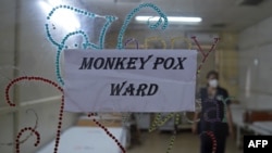 FILE - A health worker walks inside an isolation ward built as a precautionary measure for the monkeypox patients at a civil hospital in Ahmedabad, India, July 25, 2022. 