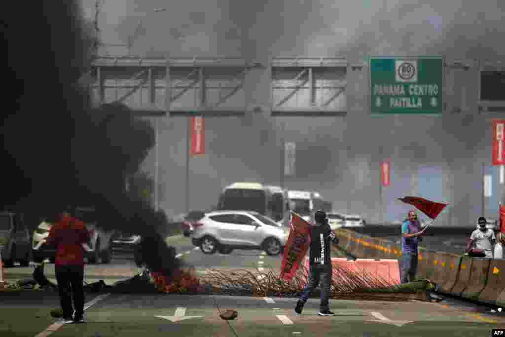 Union workers block a highway in Panama City, July 18, 2022. 