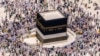 FILE - Muslim pilgrims walk around the Kaaba, the cubic building at the Grand Mosque, during the annual hajj pilgrimage, in Mecca, Saudi Arabia, on July 10, 2022.