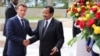 Cameroon's President Paul Biya shakes hands with his French counterpart Emmanuel Macron at the presidencial palace in Yaounde, Cameroon, July 26, 2022. 