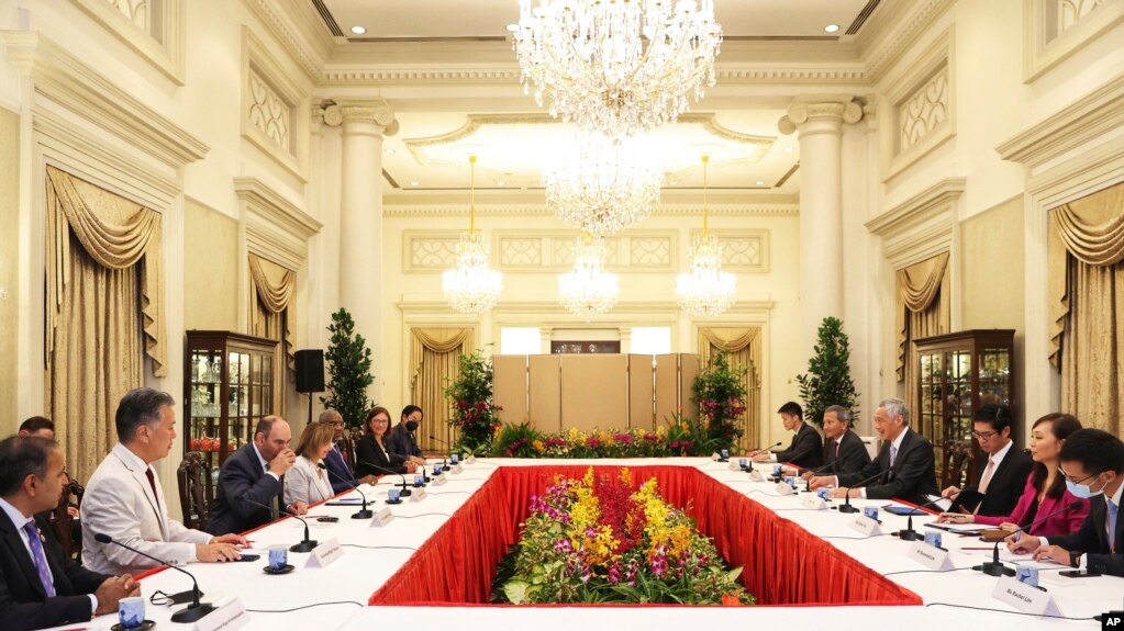 In this photo provided by Ministry of Communications and Information, Singapore, U.S. House Speaker Nancy Pelosi, fourth from left, and Prime Minister Lee Hsien Loong, fourth from right, meet at the Istana Presidential Palace in Singapore, Aug. 1, 2022. 