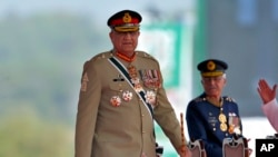 Pakistan's Army Chief General Qamar Javed Bajwa arrives to attend a military parade to mark Pakistan National Day in Islamabad, Pakistan, March 23, 2022. 