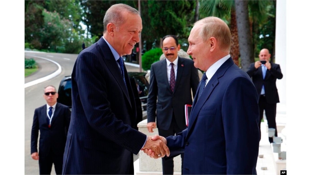 FILE - Russian President Vladimir Putin, right, greets Turkish President Recep Tayyip Erdogan upon his arrival at the Rus sanatorium in the Black Sea resort of Sochi, Russia, Aug. 5, 2022.