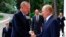 FILE - Russian President Vladimir Putin, right, greets Turkish President Recep Tayyip Erdogan upon his arrival at the Rus sanatorium in the Black Sea resort of Sochi, Russia, Aug. 5, 2022.