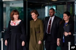 Olena Zelenska, second from left, spouse of Ukrainian President Volodymyr Zelenskyy, walks out of the State Department, July 18, 2022 in Washington, after meeting with Secretary of State Antony Blinken in a closed-to-press meeting.