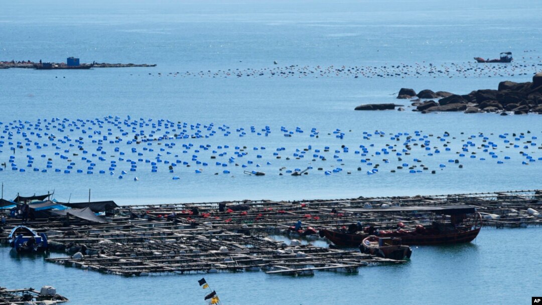 A boat moves through the water at the 68-nautical-mile scenic spot, the closest point in mainland China to the island of Taiwan, in Pingtan in southeastern China's Fujian province, Aug. 5, 2022.