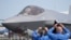 FILE: Visitors take pictures of a F35 Lightning 2 fighter plane at the Farnborough Air Show fair in Farnborough, England, July 18, 2022. 