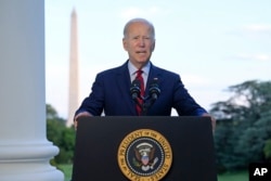 President Joe Biden speaks from the Blue Room Balcony of the White House Monday, Aug. 1, 2022, in Washington, as he announces that a U.S. airstrike killed al-Qaida leader Ayman al-Zawahri in Afghanistan. (Jim Watson/Pool via AP)